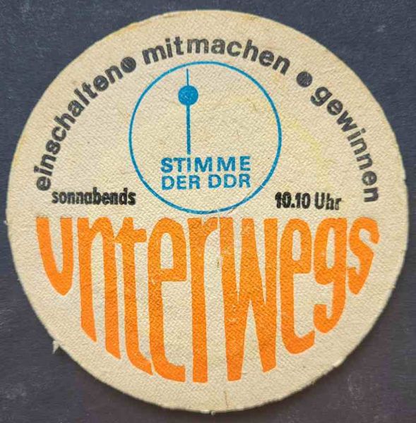 Bierdeckel von der Stimme der DDR, unterwegs